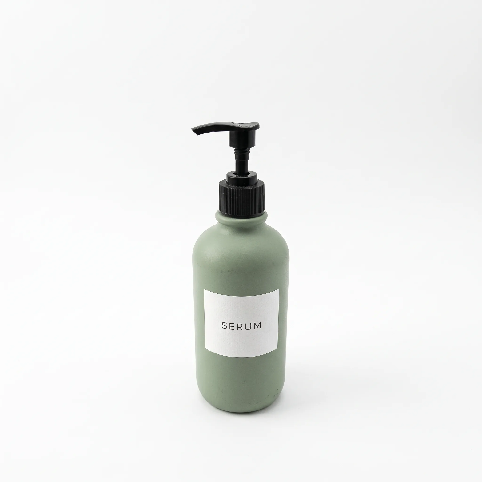 Nano Banana 2.1 result: sage-green serum bottle centered on a pure white background